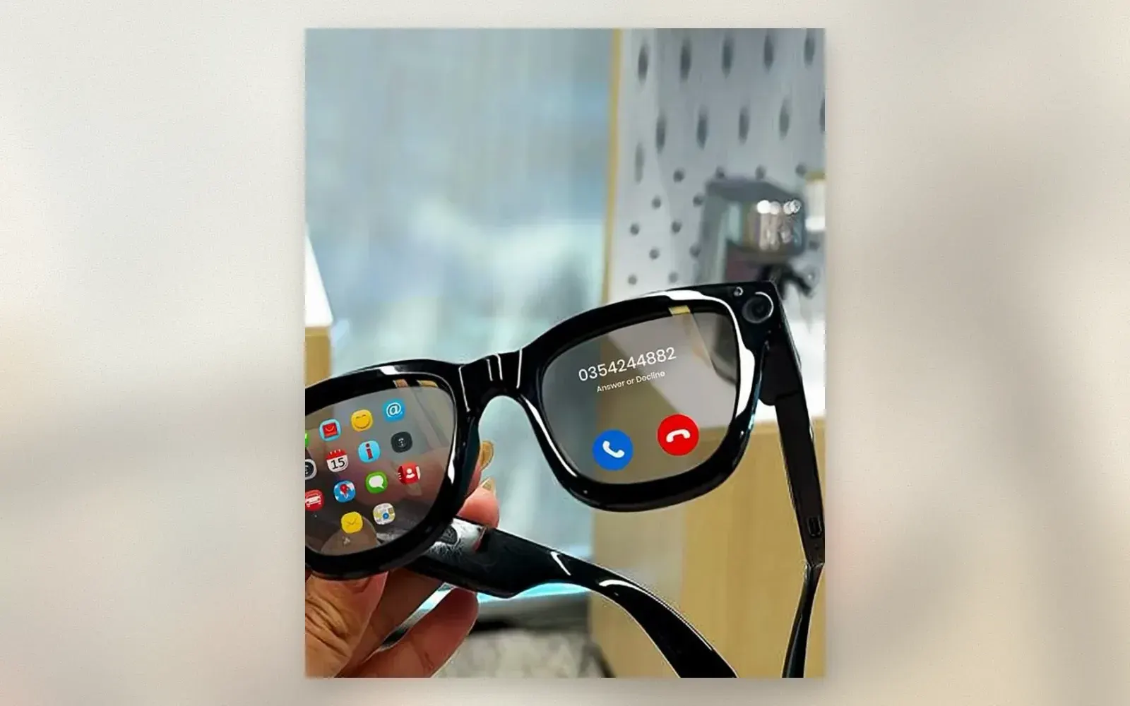 Black smart glasses with projected app grid and incoming call interface on the lenses