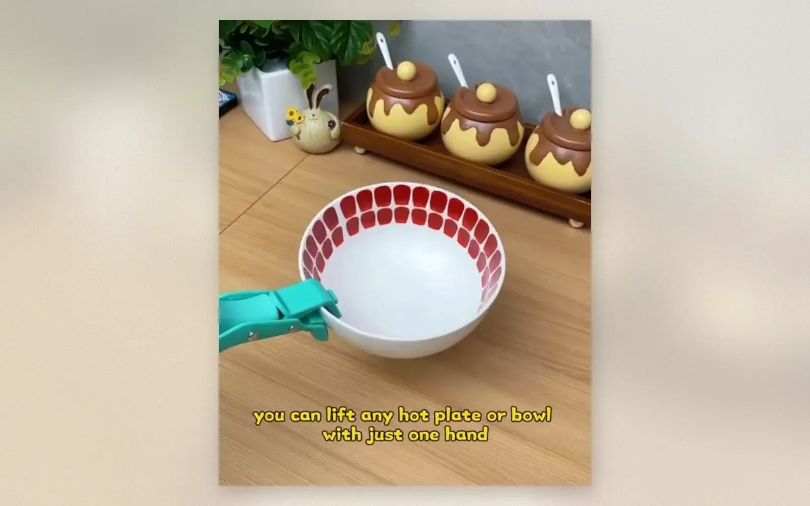 Silicone bowl gripper clamping a hot bowl with one hand