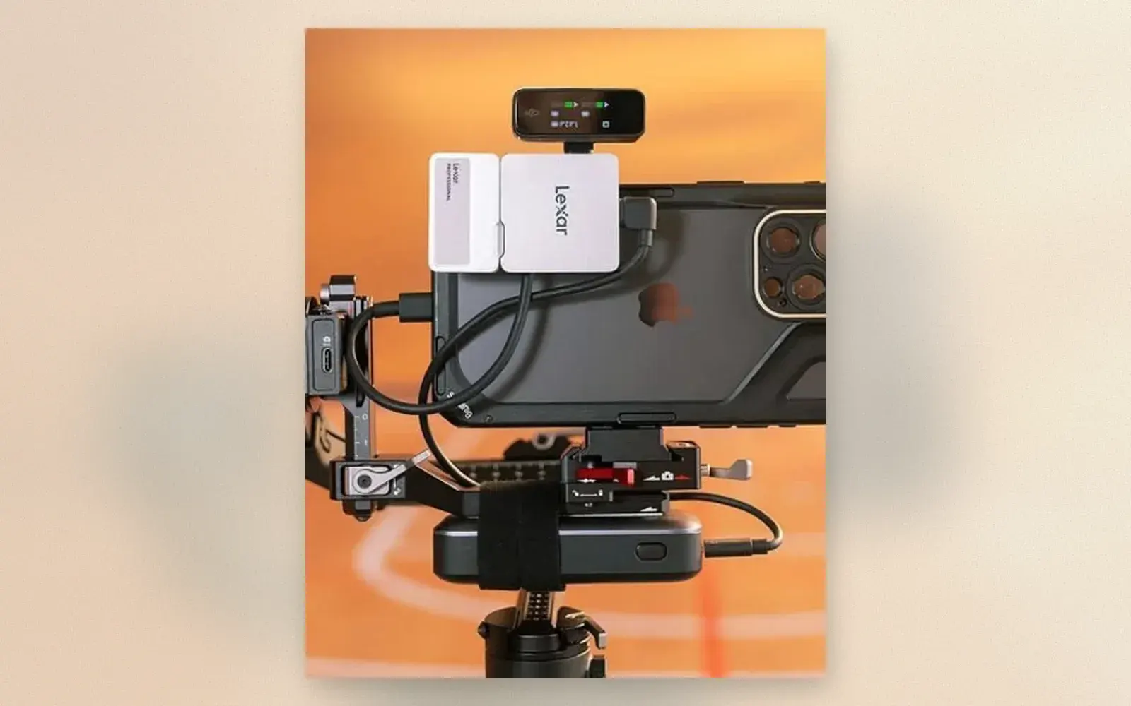 iPhone on gimbal rig with two Lexar external SSDs, top monitor, and strapped power bank