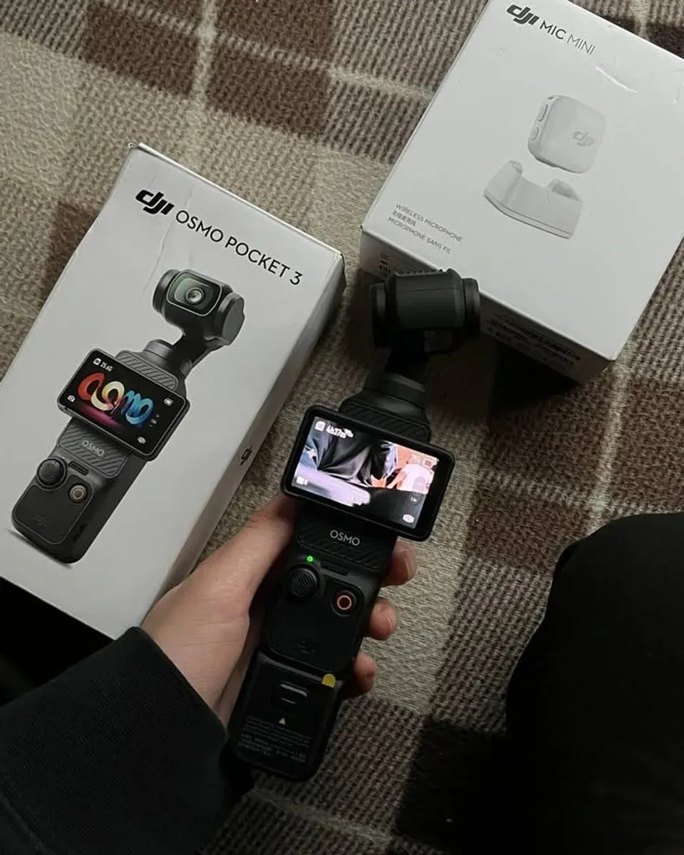DJI Osmo Pocket 3 gimbal camera held in one hand