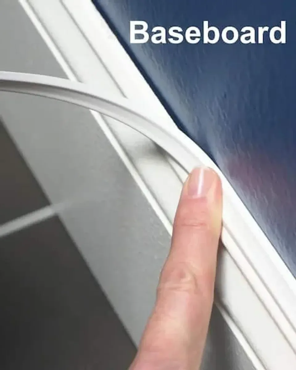 Close-up of peel and stick trim showing the decorative profile and adhesive backing