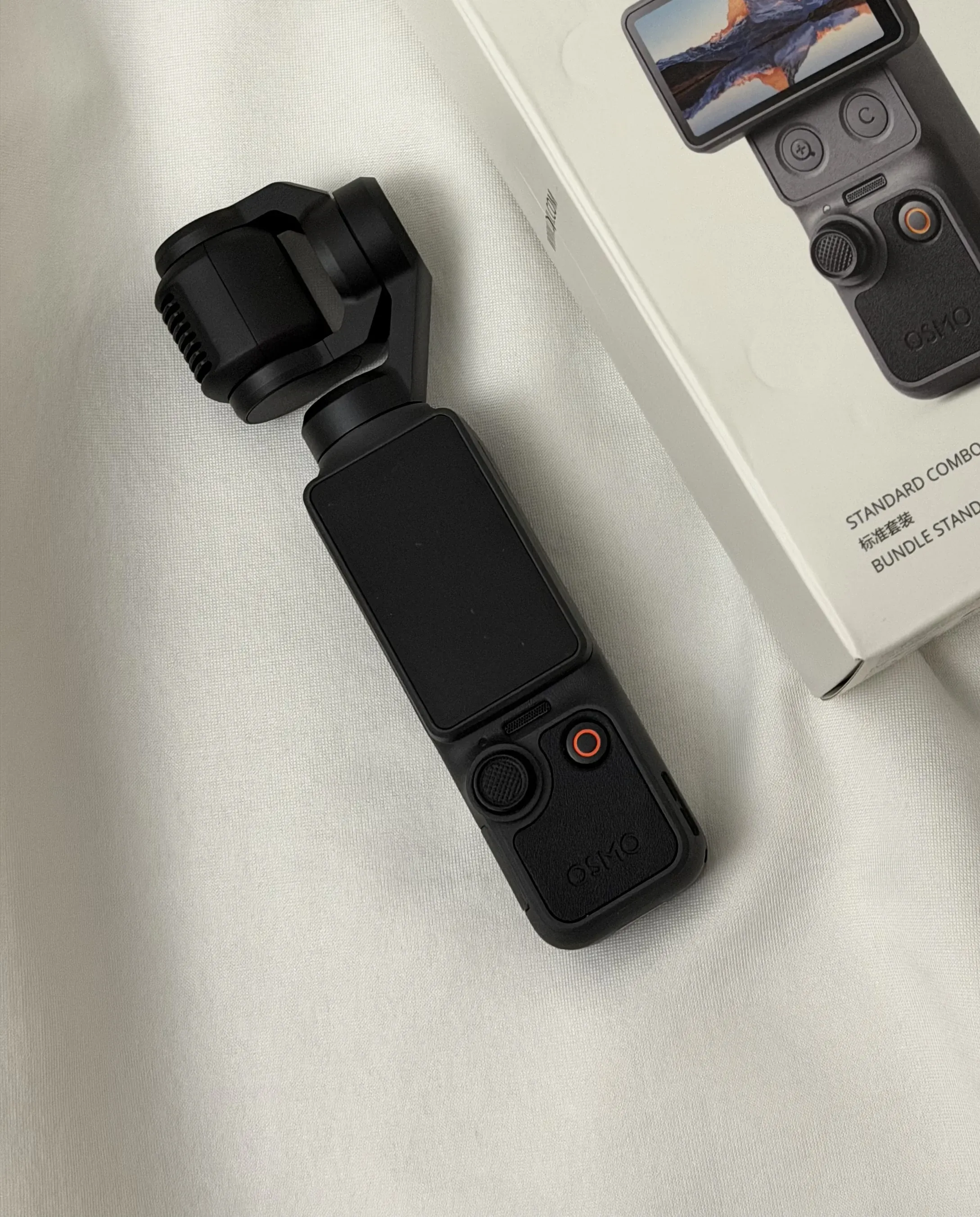 Close-up of the DJI Osmo Pocket 4 camera head and three-axis gimbal