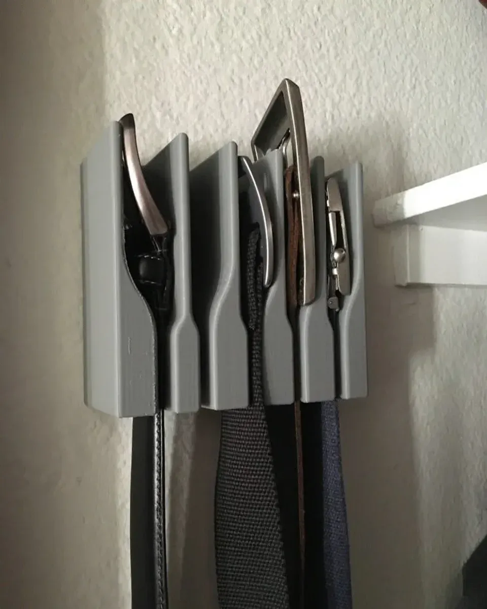 Close-up of belt buckles in the grey bracket slots