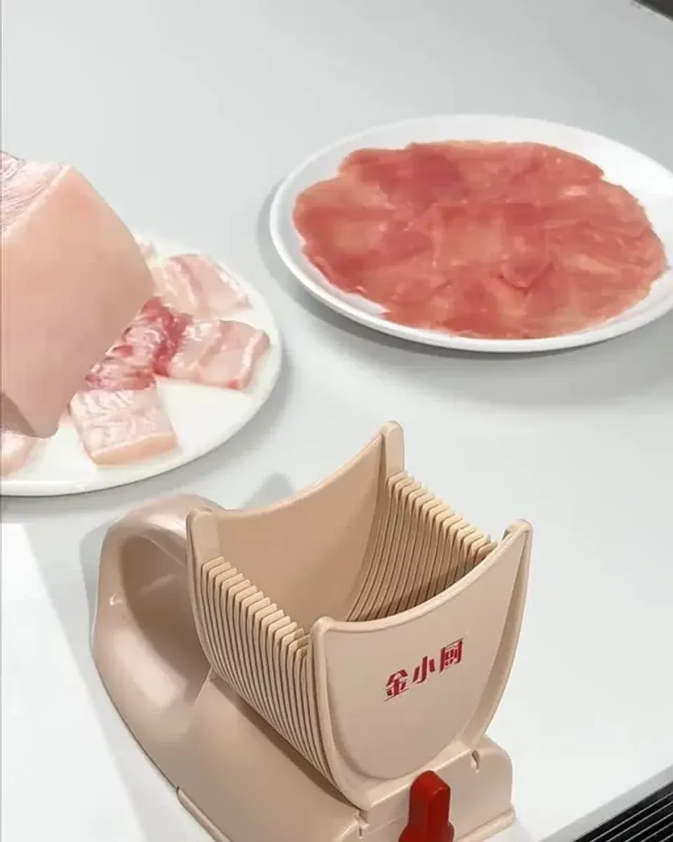 Sliced frozen meat on plates showing the thin, uniform cuts