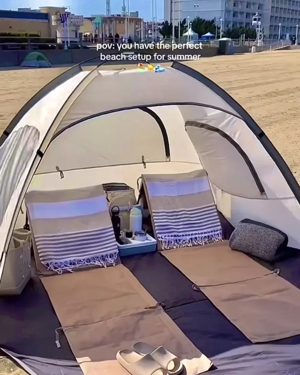 Interior of the beach tent showing space for chairs, cooler, and towels