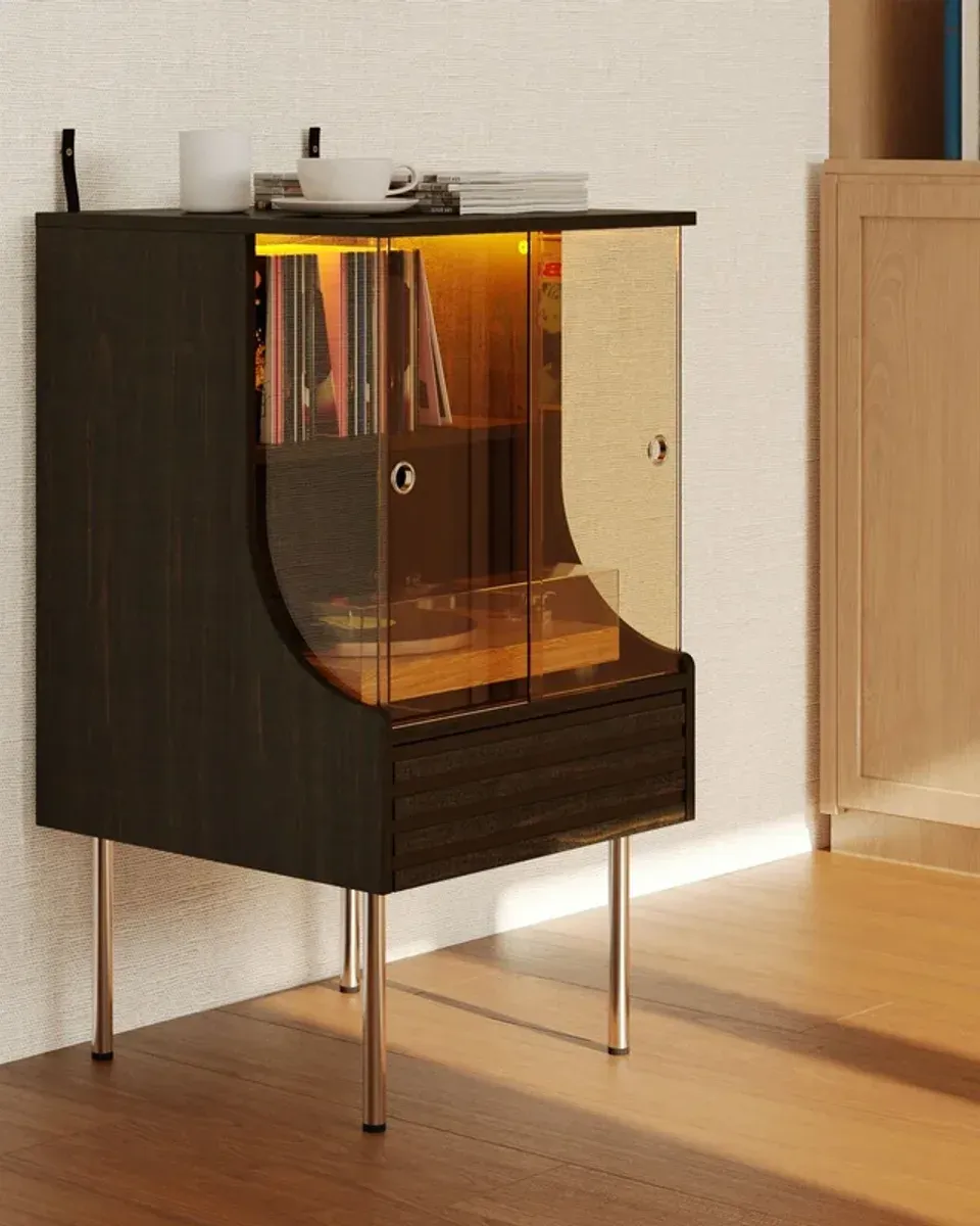 Interior of vinyl record cabinet showing vertical record storage and turntable shelf