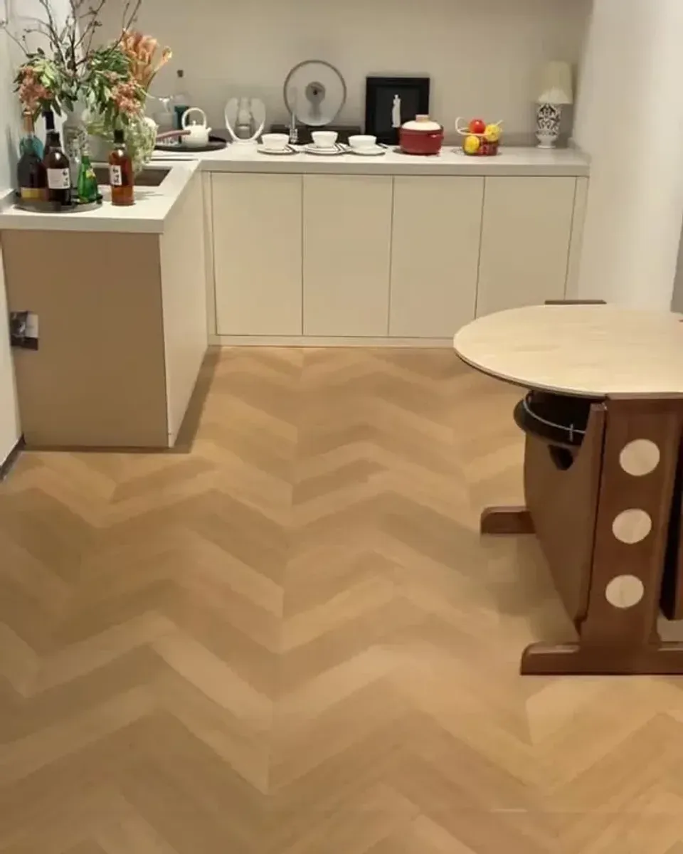 Herringbone vinyl flooring fully installed in a kitchen showing the finished pattern