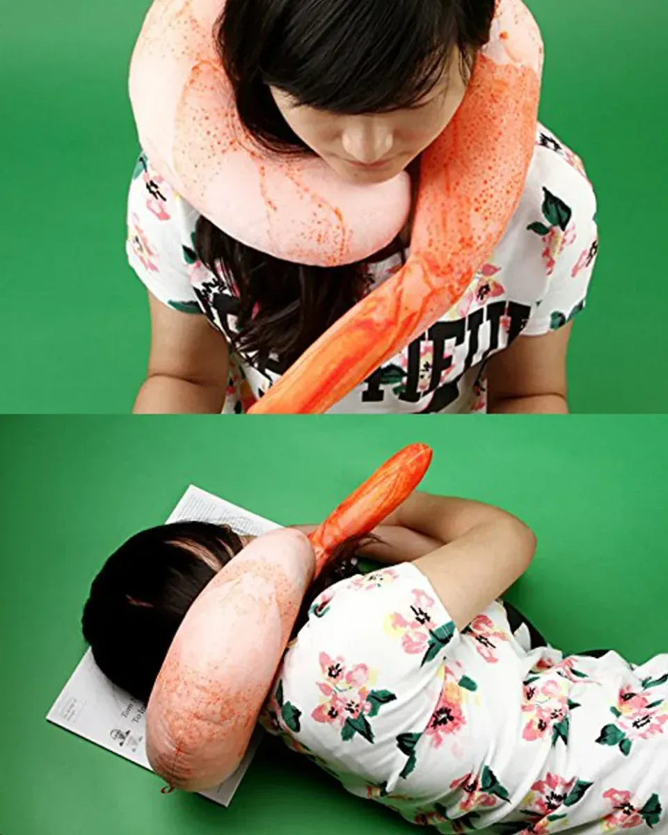 Shrimp neck pillow in use on a desk showing neck support