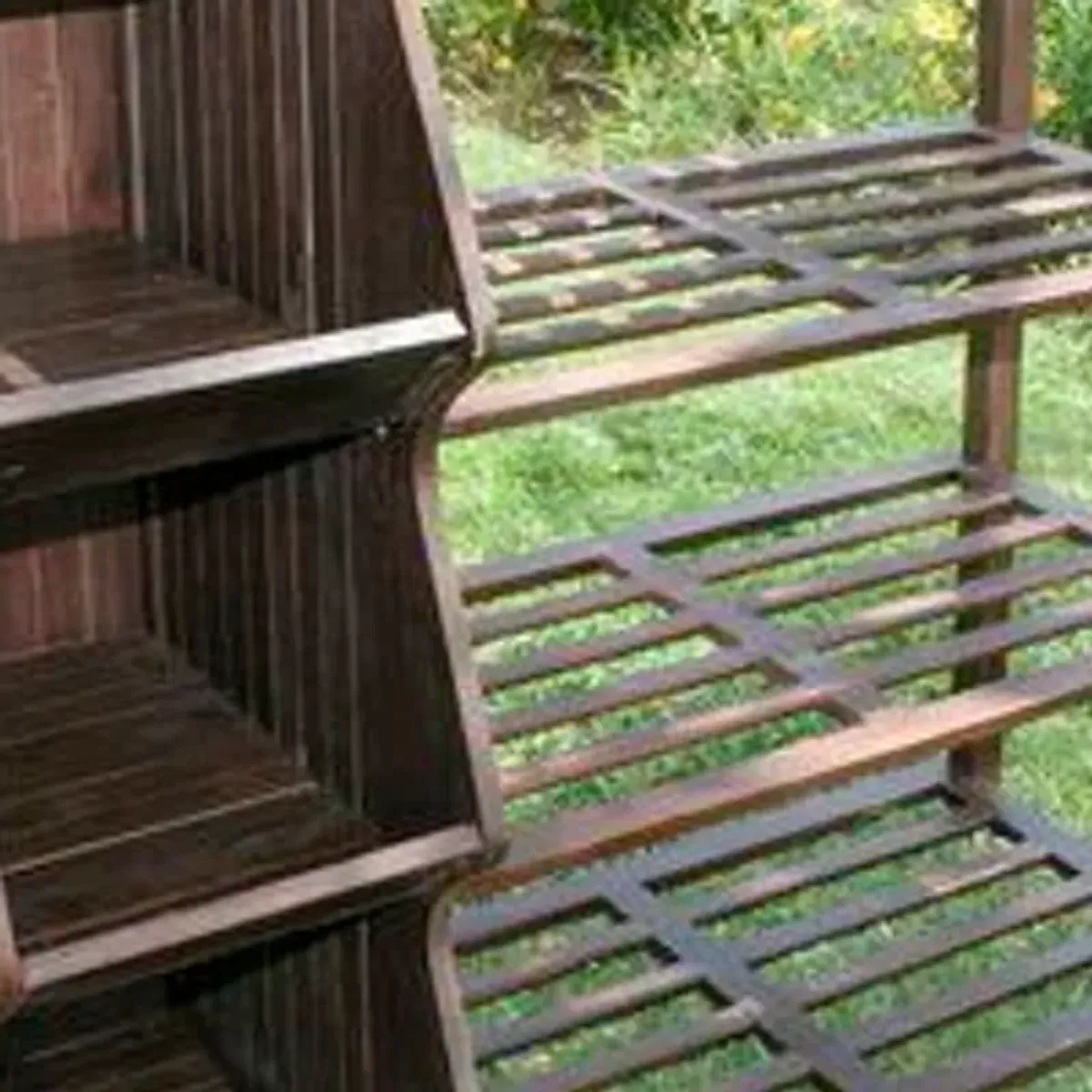 Wooden plant stand cart in an outdoor garden setting showing the full unit