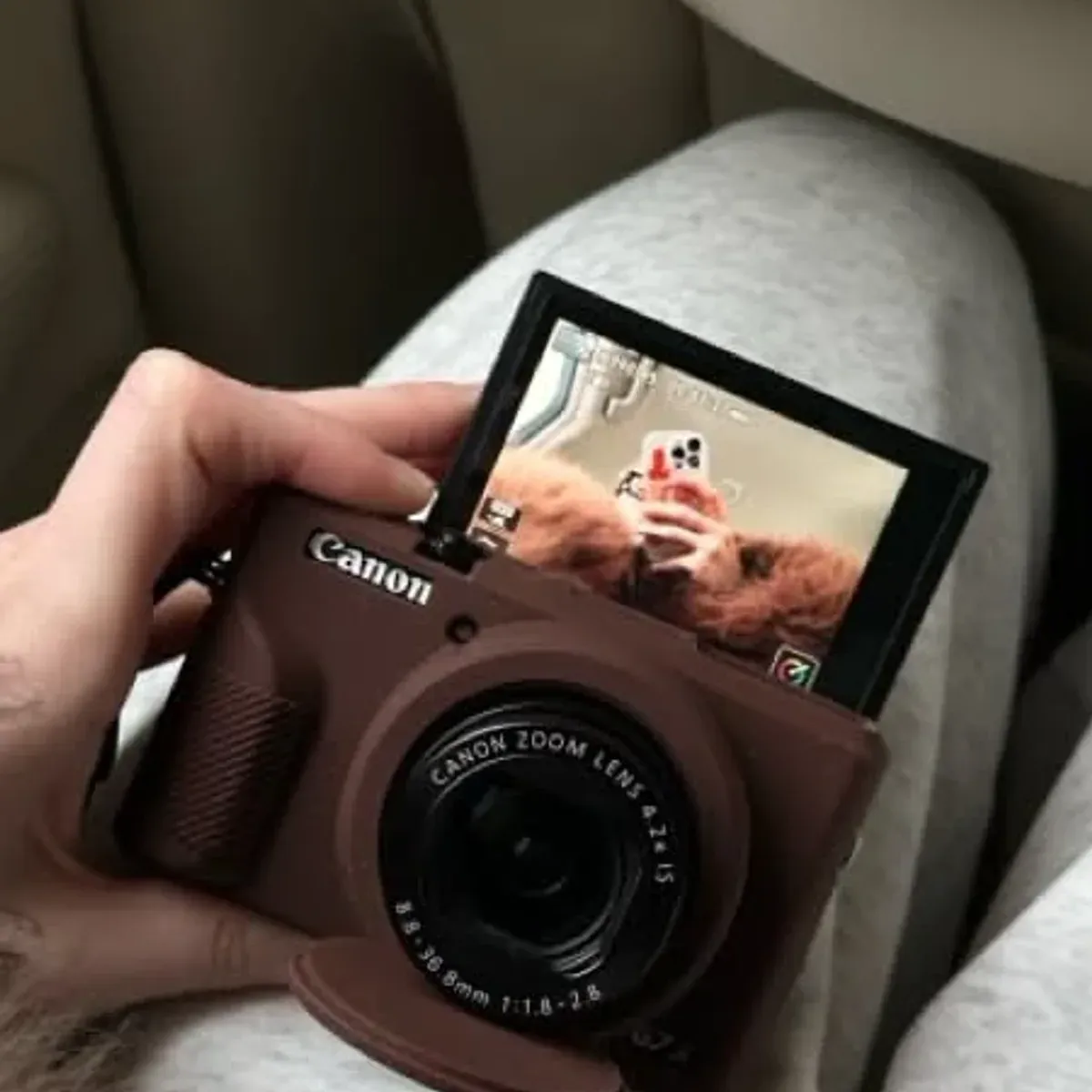 Canon G7 X Mark III flip-up screen photographed from the side in a car