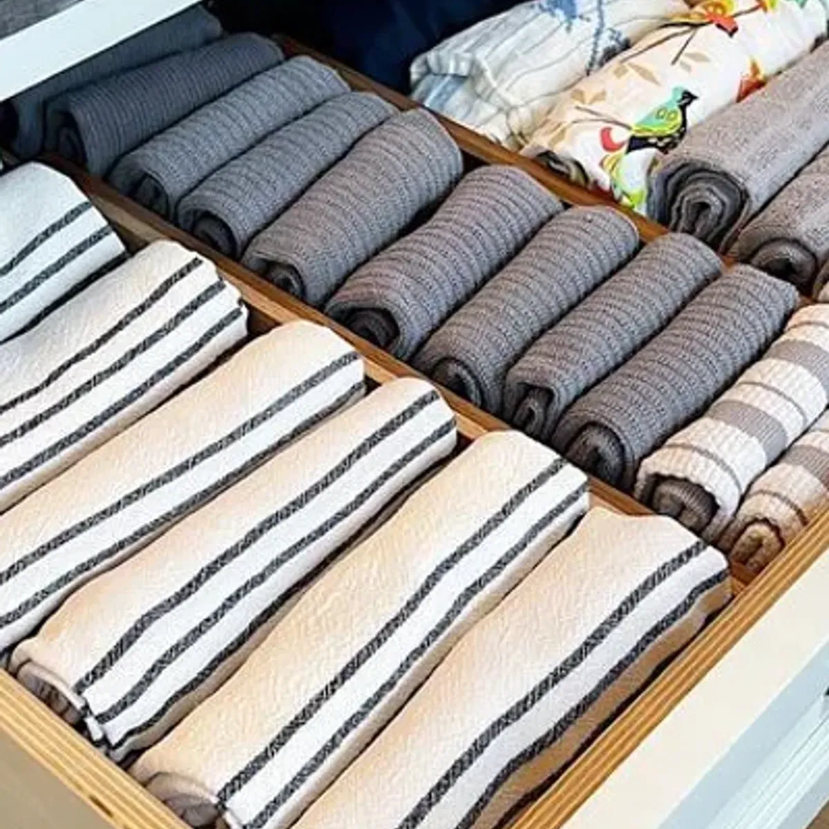 Bamboo drawer organizer installed in a kitchen drawer showing the full setup