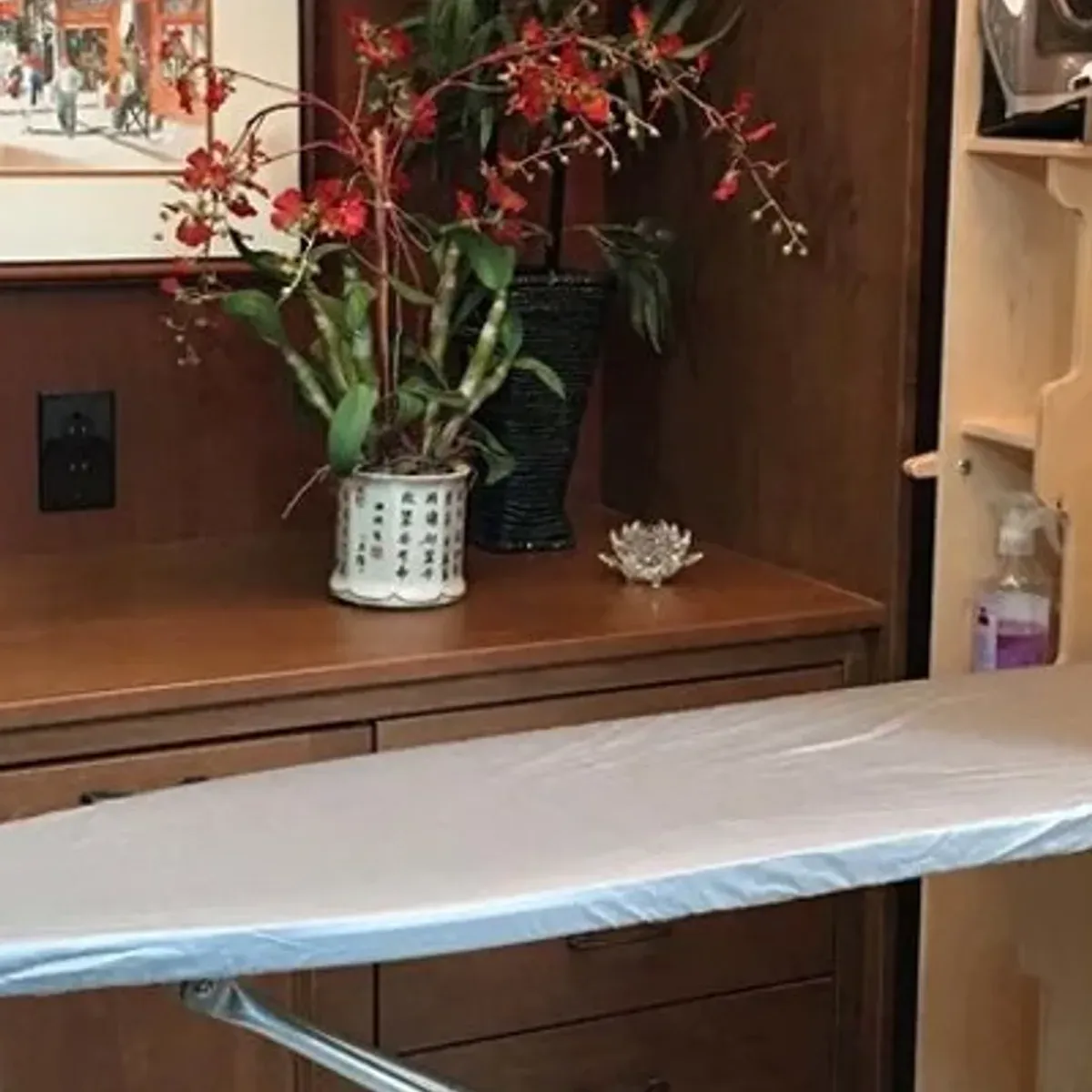 Close-up of the iron storage shelf with cord wrap and heat-resistant pad