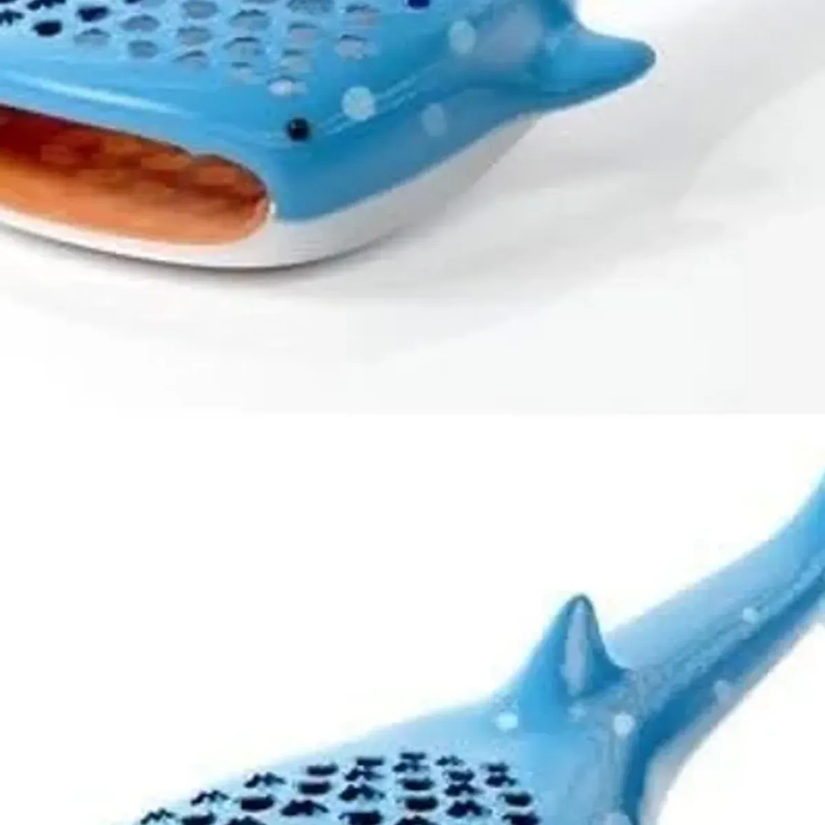 Close-up of the Shark Mouth Grater mouth opening with the orange catch tray slotted in