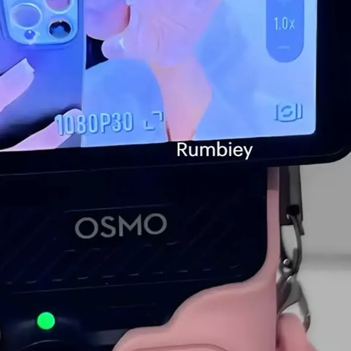 Macro view of the case buttons and cutouts on the Osmo Pocket 3