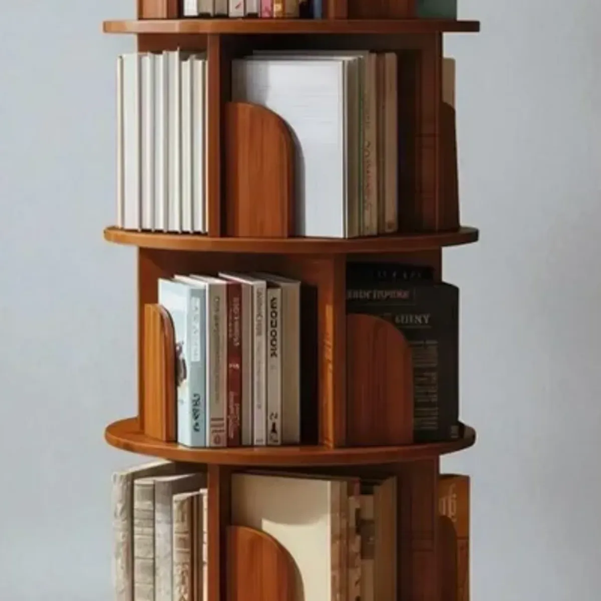 Rotating bookshelf tower showing the drawer and caster base