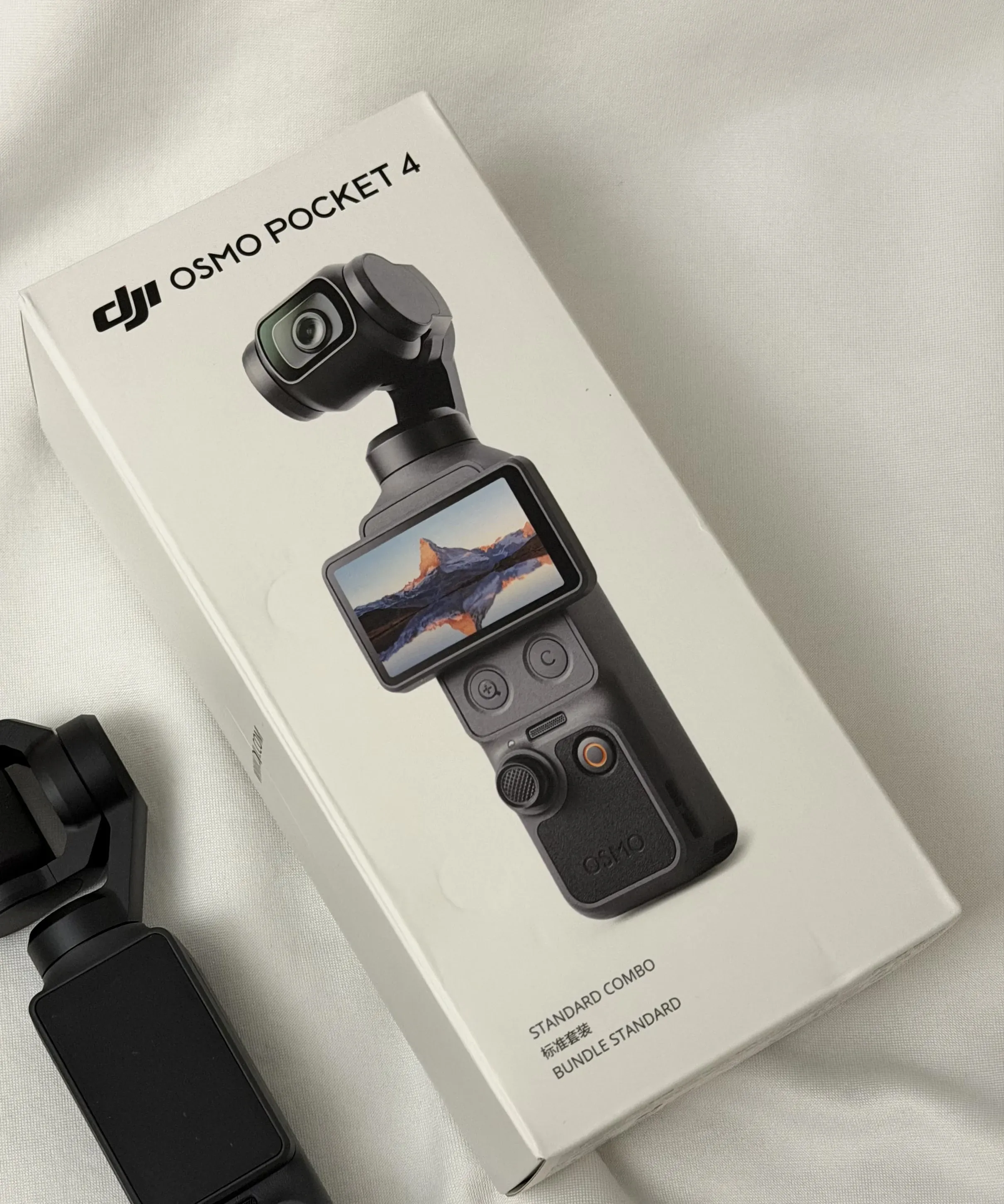 DJI Osmo Pocket 4 control buttons and two new shortcut buttons near the rotating screen
