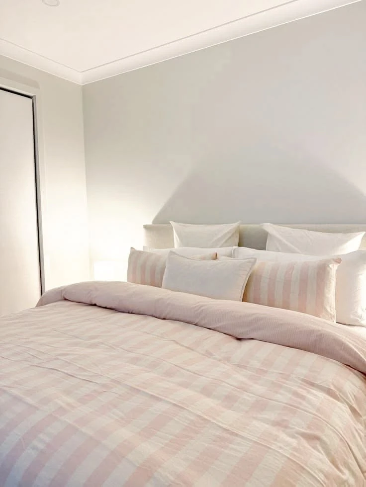 Close up of the pink and white check washed cotton duvet cover fabric