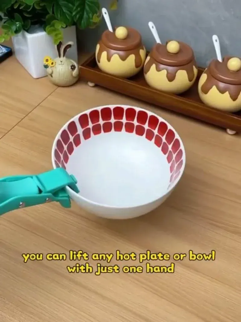 Silicone bowl gripper clamping a hot bowl showing the one-hand operation