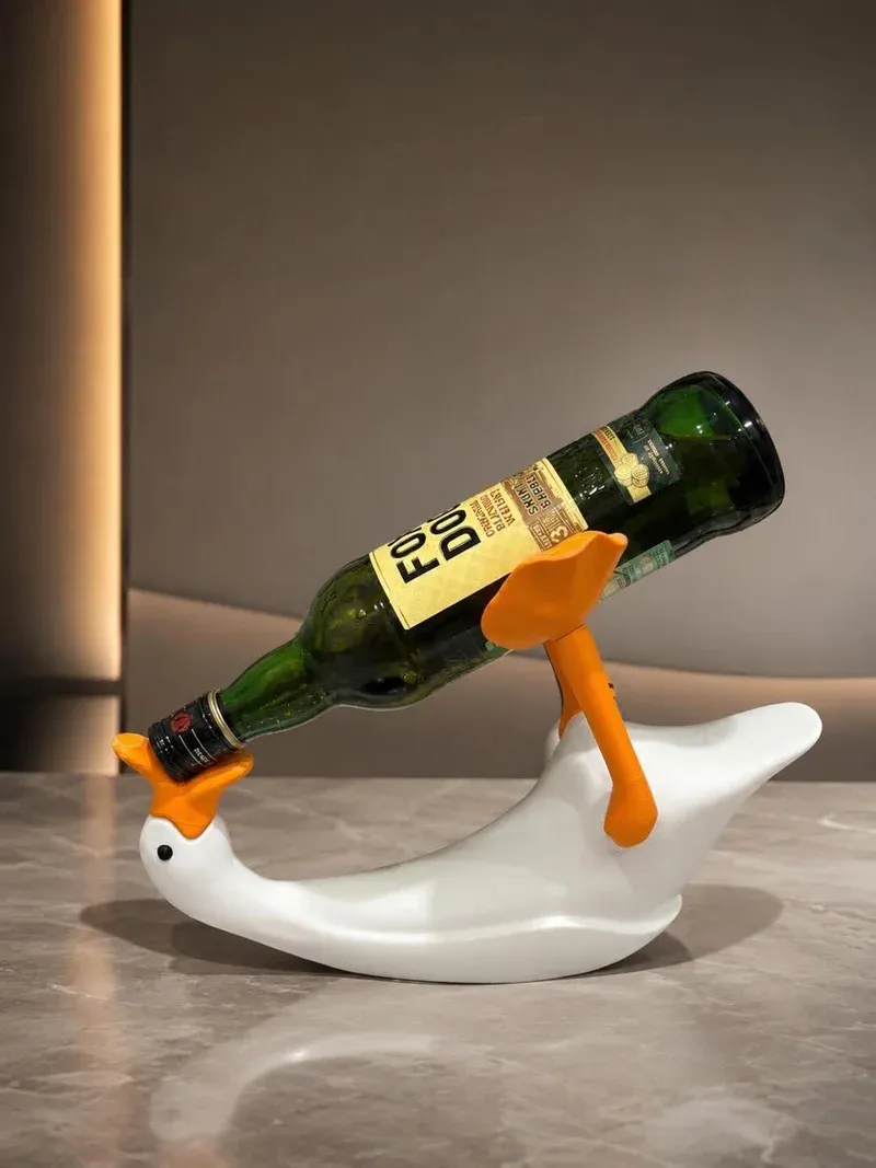 Duck wine bottle holder showing the wine bottle balanced on beak and tail