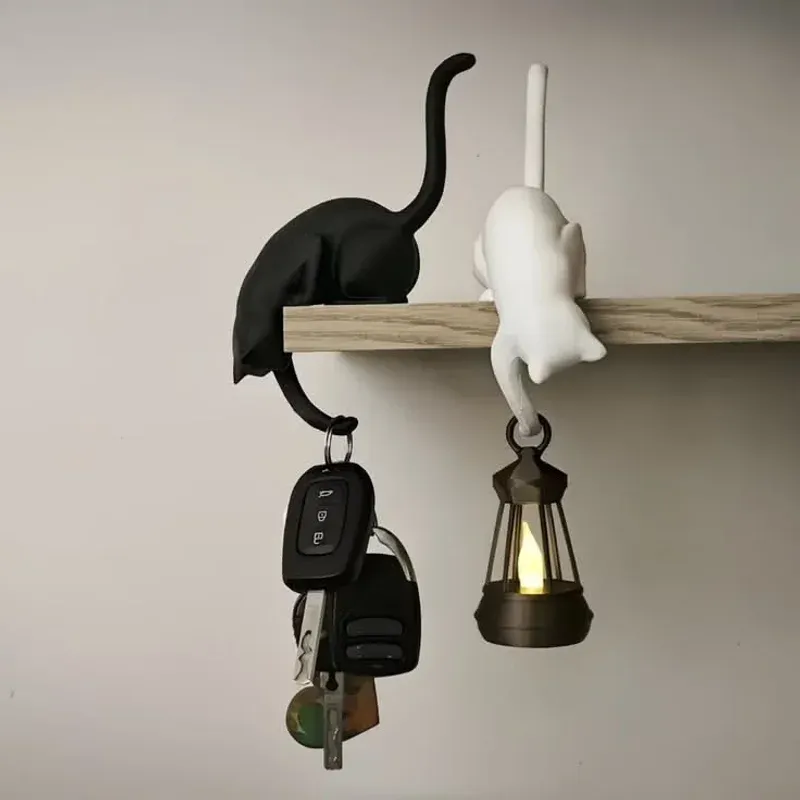 HELP doorstop figurine being crushed by door holding HELP sign