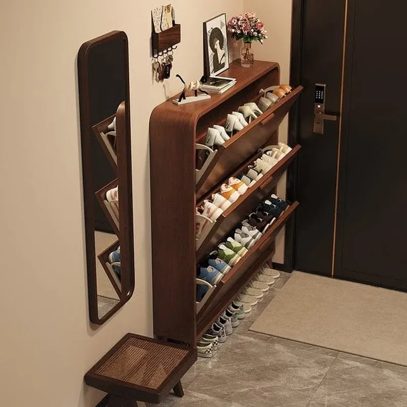 Tall slim shoe cabinet showing the tilted compartments and walnut finish