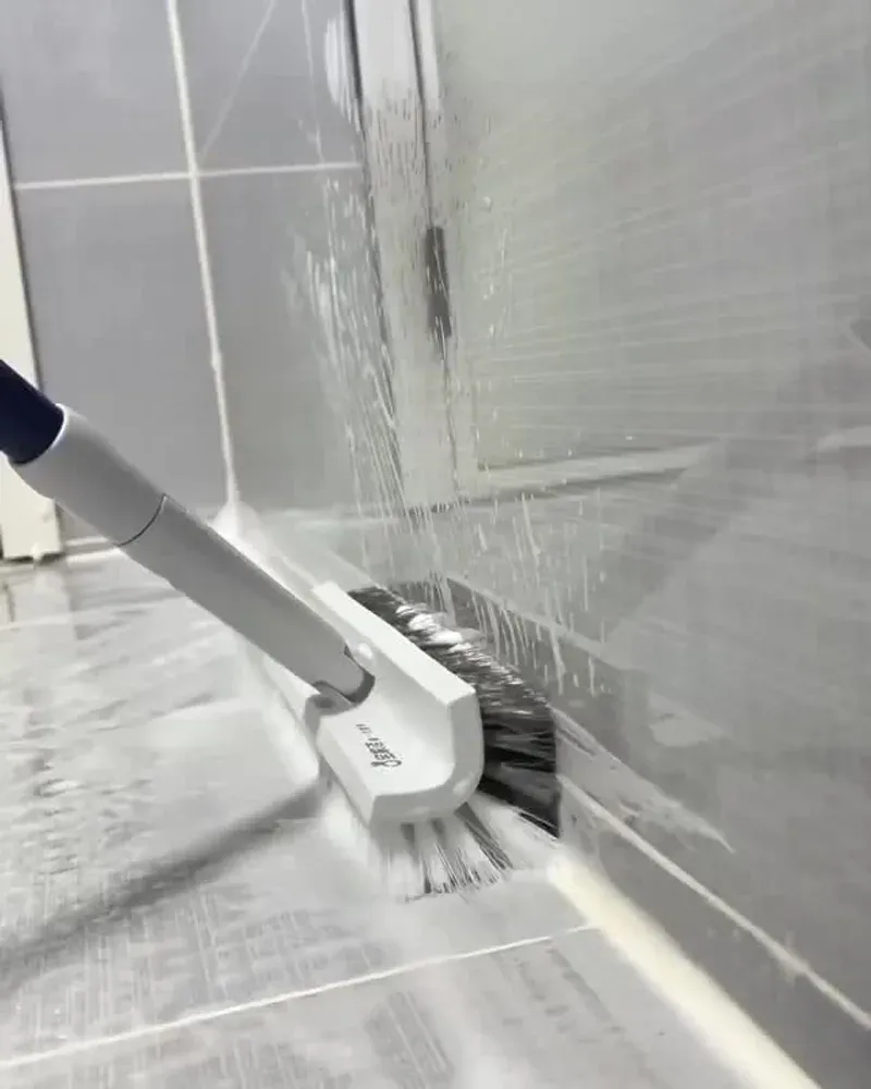 Corner cleaning brush scrubbing the junction between floor and wall