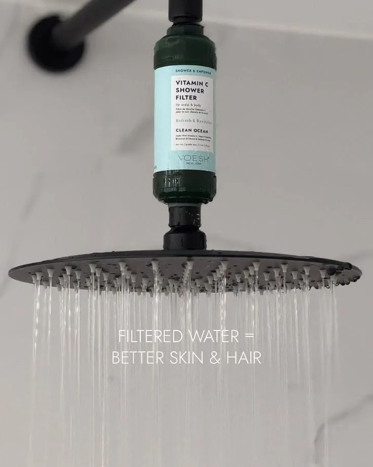 Closeup of the VOESH cartridge mounted between shower arm and rain shower head